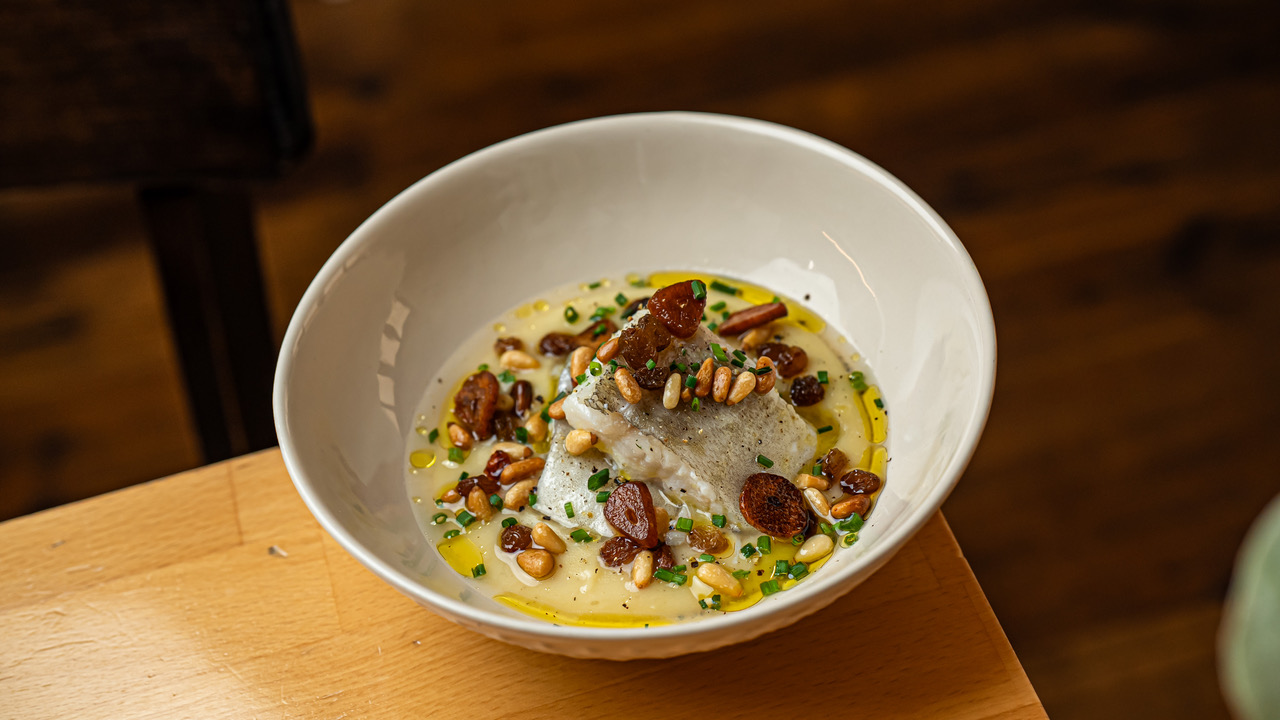 Mes de Vi Cod confit, roasted garlic parmentier, dates & pines